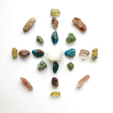 A crystal grid with several assorted crystals.