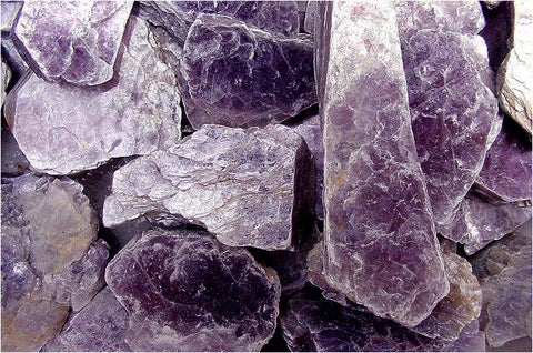Many large chunks of Lepidolite crystal are visible in this picture.