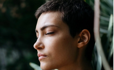 Woman in peaceful mindful contemplation to bring happiness and peace