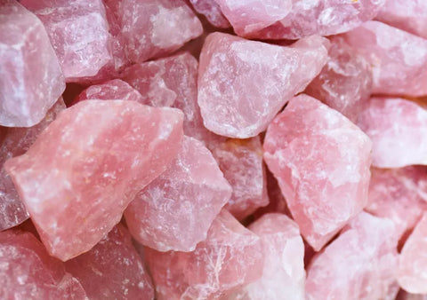 Many large chunks of Rose Quartz crystal are visible in this picture. Rose Quartz is one of many grief crystals.