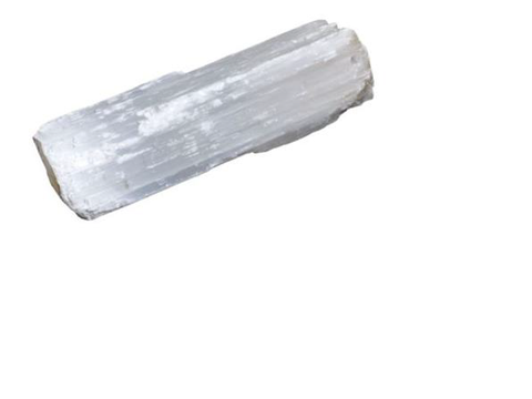 Selenite wand against a clear background