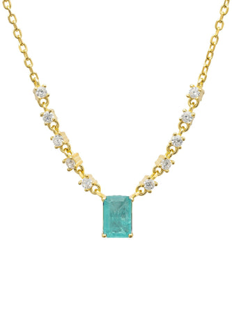 A yellow gold necklace with a Paraiba tourmaline gemstone.