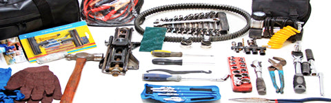 assortment of mechanics hand tools on the floor