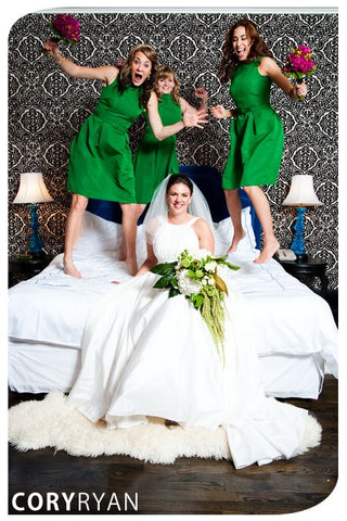 Fun on the bed bridal party photo