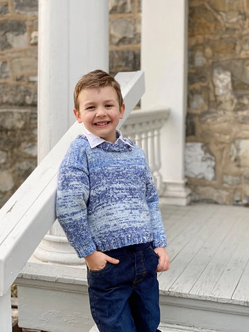 boy in blue sweater