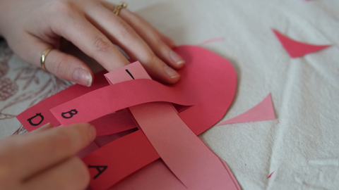 Piper and Leaf crafter continuing the weaving process for a DIY galentine valentine craft