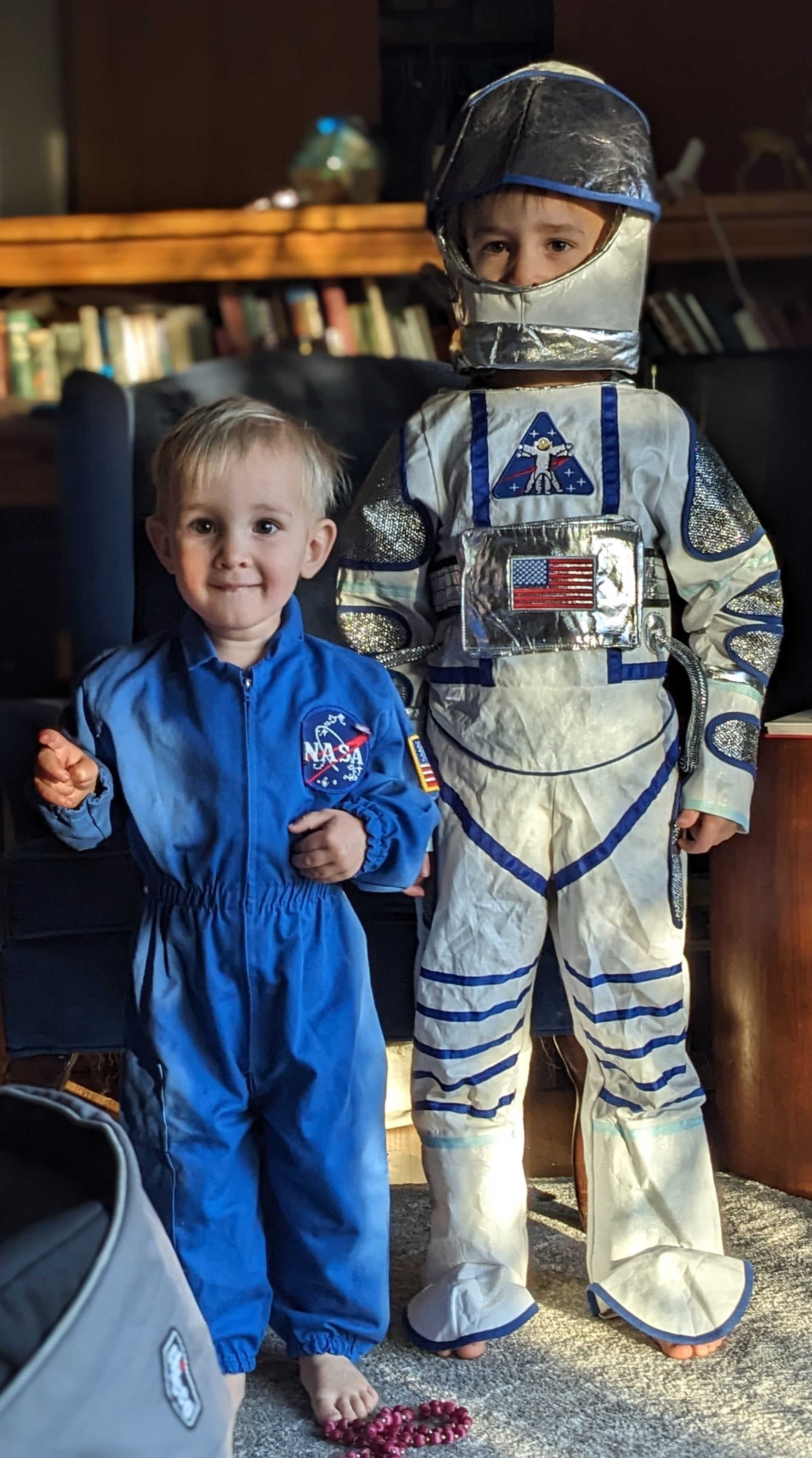 two of the younger Piper and Leaf kids, brothers, adorned in their astronaut suit, geared and ready for space exploration