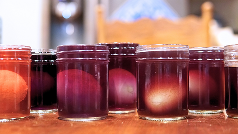 All of the eggs in their tea dye baths for a fun, easy DIY Easter craft with Piper and Leaf