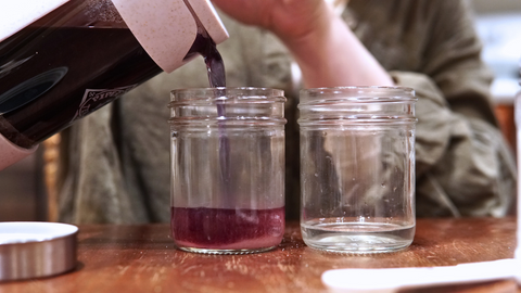 Tea concentrate poured from Piper and Leaf Piper Press into a jar