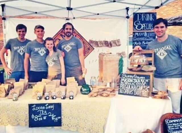 A photo of the early Piper & Leaf booth in 2013 run by three of the owners, a sibling, and a friend