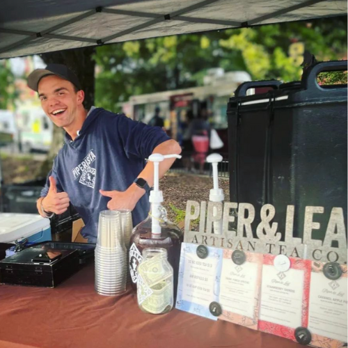 A Piper & Leaf employee hanging out at our event tent downtown HSV