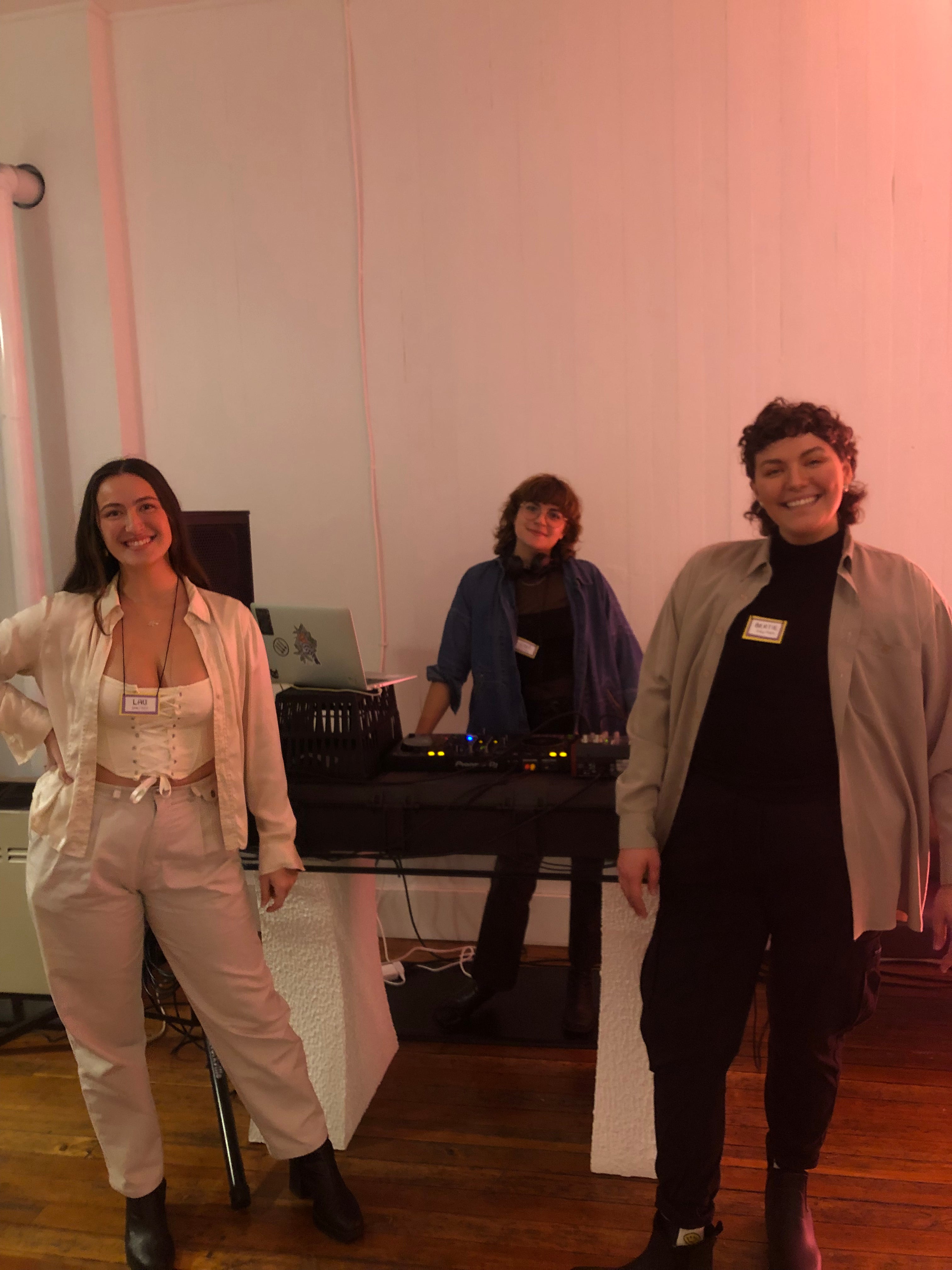 Bertie, DJ Gasolina, and Lau smiling at the camera around the DJ booth