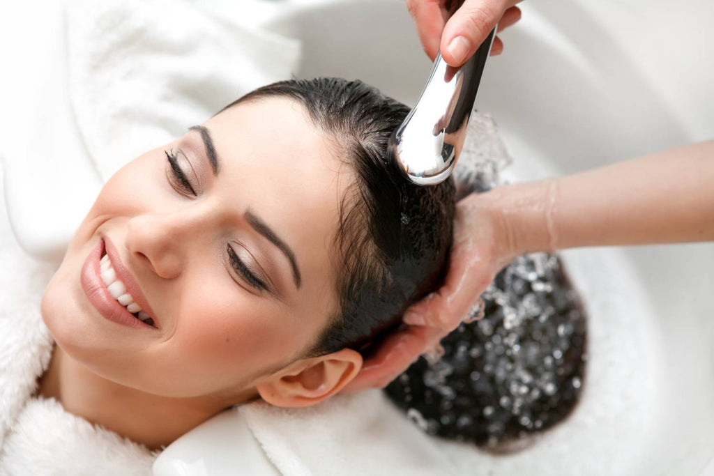 female getting Brazilian blowout hair treatment