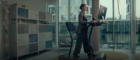 Emilia Clarke with Walkolution Treadmill Desk in The Pod Generation Movie