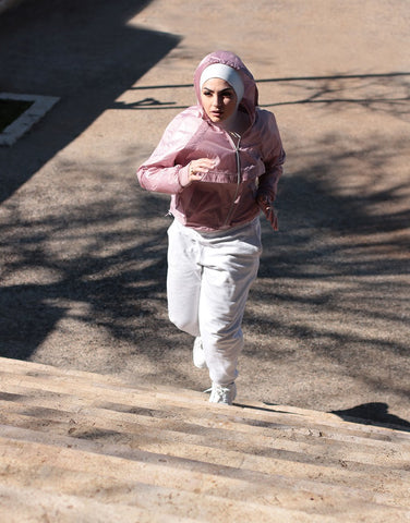 Woman running in Ruuq Hijab Bodysuit Sleeveless