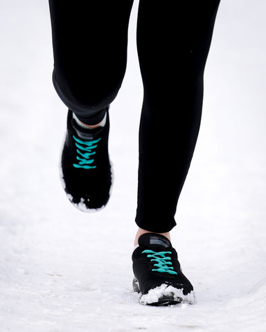 Blue shoelaces on black running shoes