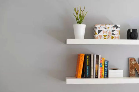 Adding a bookshelf for your favorite books and magazines, whether still or wall-mounted, makes your workstation organized.