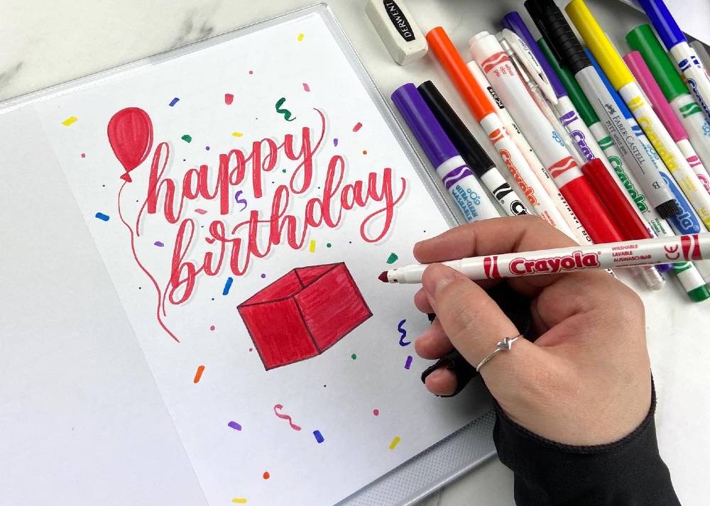 Andra demonstrates how she uses lettering to create her own greetings cards