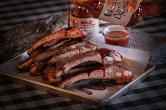 Lefty’s gluten free bbq sauce is drizzled over freshly smoked bbq pork