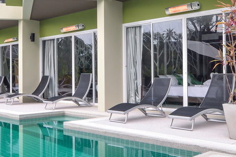 An outdoor pool area with multiple VA-20R Infrared Heaters set up