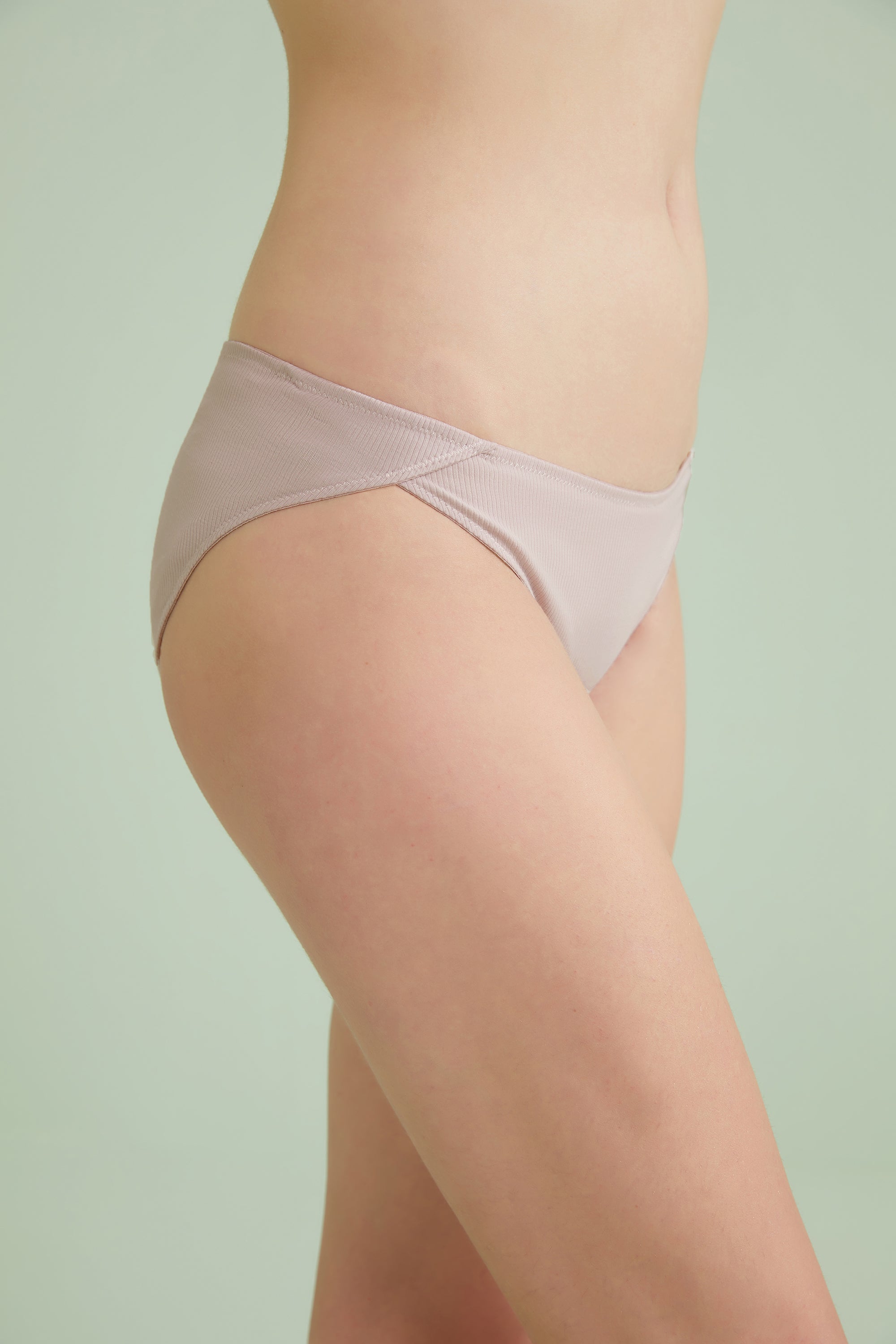 Model wearing NEIWAI's Pure Comfort Ribbed Low Waist Cotton Brief in Pink Nectar.