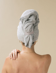 woman with hair in microfiber towel turban