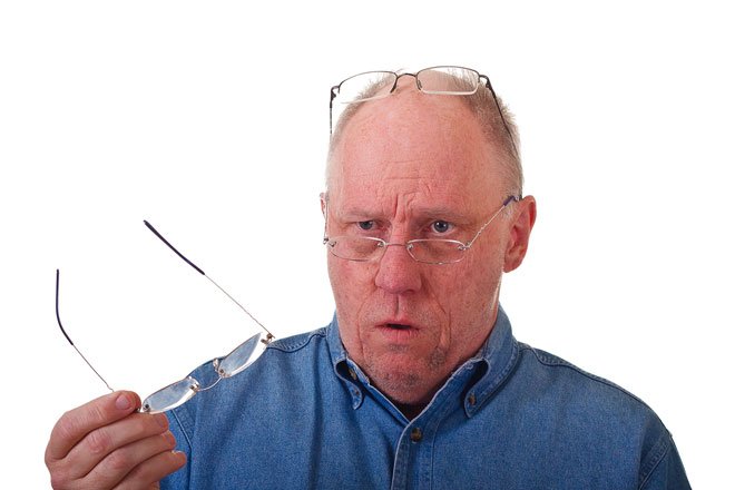 Older Balding Man Confused Over Reading Glasses