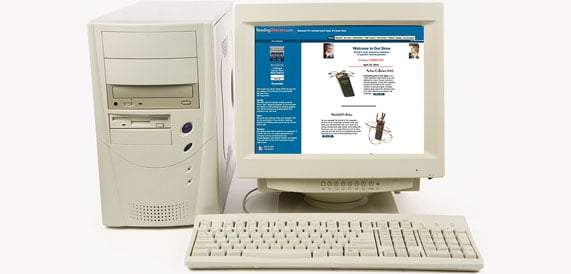Old computer with a screenshot of our website circa 2000