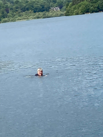 Female swimming in a lake