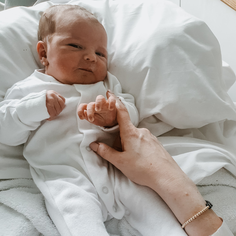 Rachael with baby Tobias and personalised bracelet