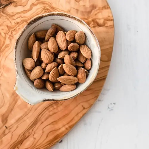 Small bowl of whole almonds.