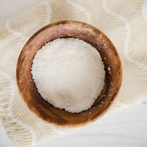 Small wooden pot of coconut flour.