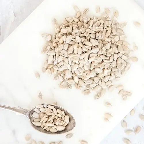 Bowl of chia seeds on yellow tea towel