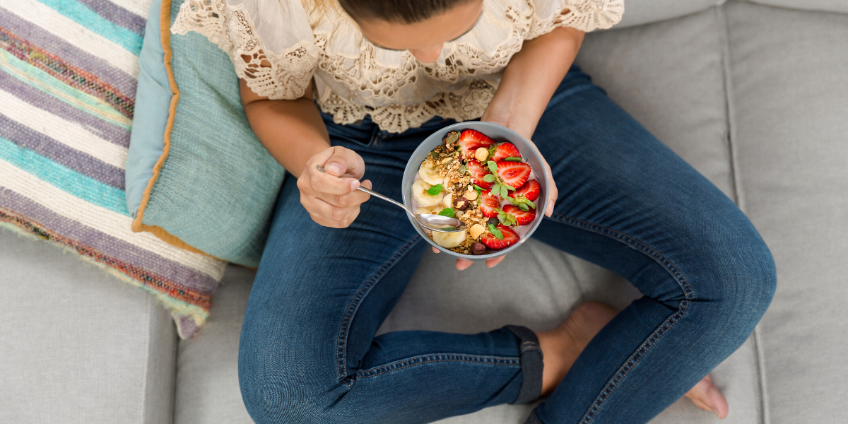 Woman eating a healthy breakfast during menopause