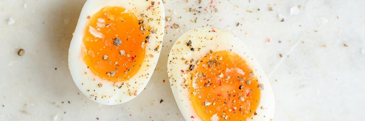 Soft boiled eggs sprinkled with salt and pepper.