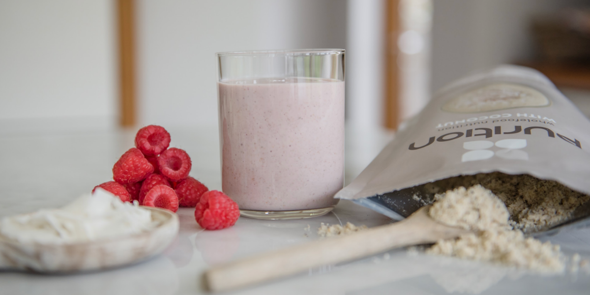 Purition coconut made into a smoothie with added fresh raspberries for a Keto meal shake.