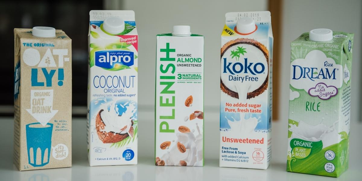Variety of plant-based milks including Oatly, Alrp, Plenish, Koko & Rice Dream