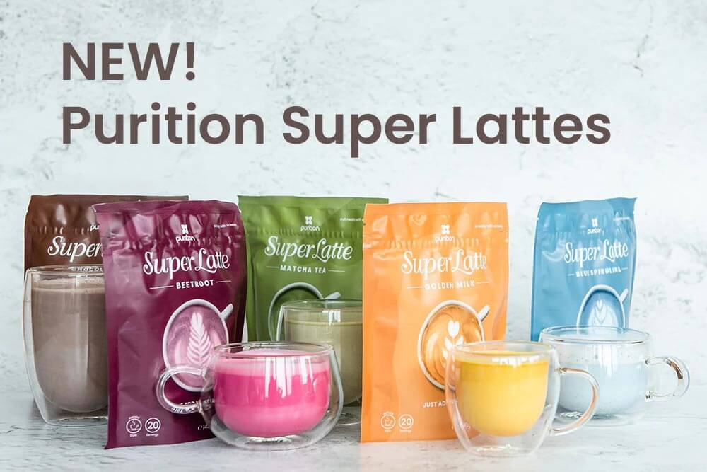 A group of glass cups of 5 colourful Purition Super Latte flavours; Chocolate, Beetroot, Matcha Tea, Golden Milk and Blur Spirulina