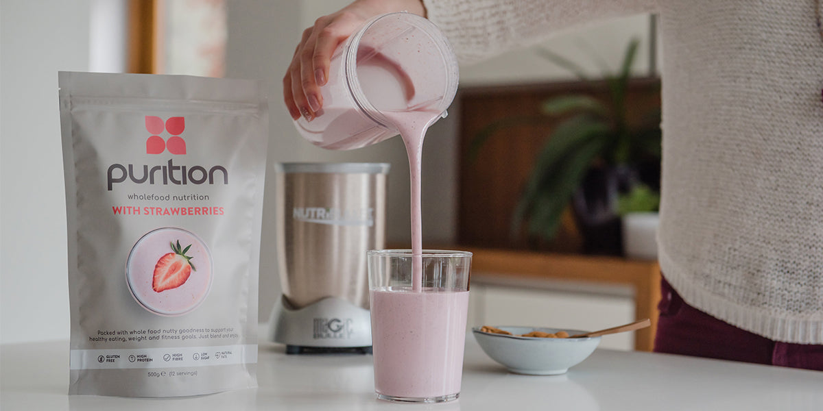 Purition Strawberry shake suitable for weight loss, being poured into a glass.