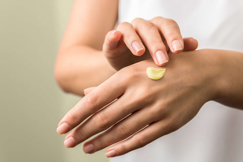 Rubbing infused lotion from the magicalbutter machine onto hands