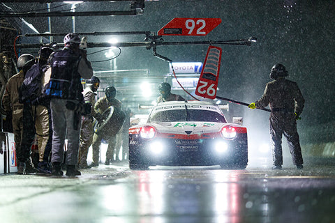 Larry Chen Photographing Porsche Race Car in Rain