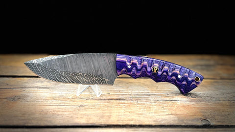 A BigHorn Steel Damascus everyday carry knife with a deep purple handle