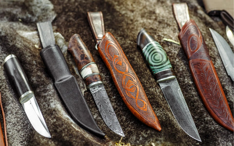 A collection of historical knives including a Damascus knife