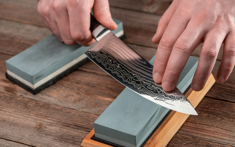 Sharpening a Damascus knife on a whetstone