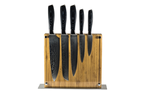 Multiple Damascus steel knives in a transparent knife block
