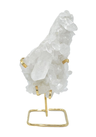 crystal quartz on a metal stand 