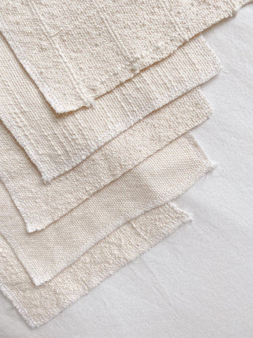 five organic cotton fabric samples featuring texture