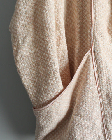Close up of front seam and pocket showing piping details.