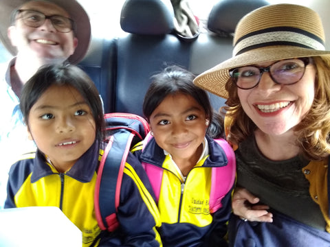 Mark and Alison with 2 of Cesar's children in a taxi in Ecuador