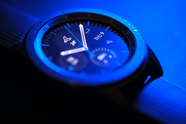 Close up of a Samsung watch in a blue light